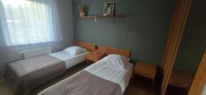 Een bed of bedden in een kamer bij Ośrodek Wczasowy Bursztyn