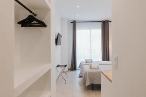 TV a/nebo společenská místnost v ubytování Hulot B&B Valencia