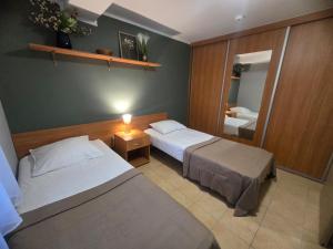 Een bed of bedden in een kamer bij Ośrodek Wczasowy Bursztyn