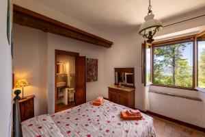 En eller flere senge i et værelse på Agriturismo Il Cocco