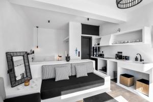 a living room with a couch and a mirror at Amenti Horizon View in Agkidia