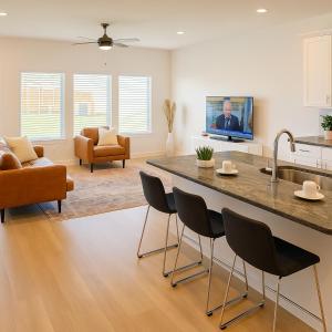 a kitchen with a large island in a living room at Quiet Haven in Richmond