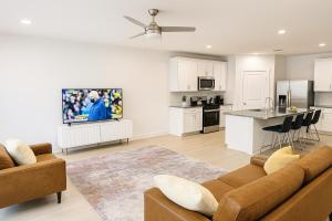 a living room with a couch and a kitchen at Quiet Haven in Richmond
