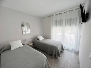 Postel nebo postele na pokoji v ubytování LUXURY SAUNA by CONFORTSKY