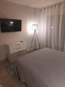 Postel nebo postele na pokoji v ubytování LUXURY SAUNA by CONFORTSKY