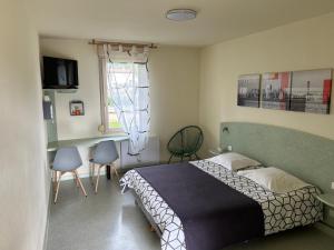 Postel nebo postele na pokoji v ubytování Abel Hôtel