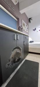 a room with a wall with a fish painted on it at AN edom suite in Eilat