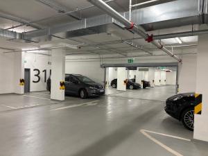 a parking garage with cars parked in it at Pension SKLEP in Prague