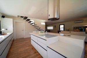 A kitchen or kitchenette at UNIQUE Homes Lajares - Only Adults
