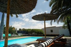 The swimming pool at or close to UNIQUE Homes Lajares - Only Adults