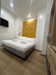 Voodi või voodid majutusasutuse Hotel Ercoli House toas