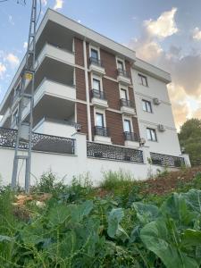 a building with a garden in front of it at My Trabzon trend house in Trabzon