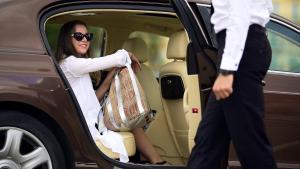 a woman sitting in the back of a car at Hotel Bologna in Prague