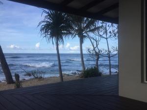 a view of the ocean from the porch of a house at Dany Island in Luganville