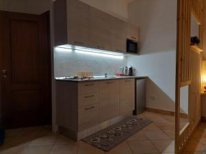 a kitchen with a sink and a counter top at Galanthus in Aosta