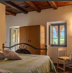 a bedroom with a bed and a window at Coletti Pietro snc in Fabbrica