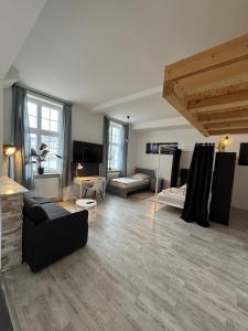 a living room with a couch and a table at Viersen Schöne Apartments am Dülkener Bahnhof Vi01 bis Vi09 in Viersen