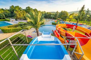 a water slide at a water park at Kapsulové ubytovanie Resort AQUA MARIA in Veľaty