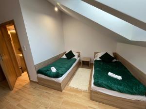 Ένα ή περισσότερα κρεβάτια σε δωμάτιο στο Centrum Rozwoju Lokalnego