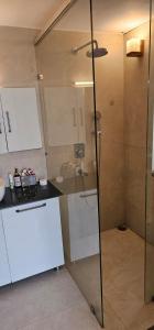 a shower with a glass door in a bathroom at Bougainvilla Mountain Retreat in Bhīm Tāl +62 photos