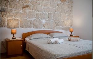 Postel nebo postele na pokoji v ubytování Apartments Kordić