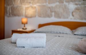 Postel nebo postele na pokoji v ubytování Apartments Kordić