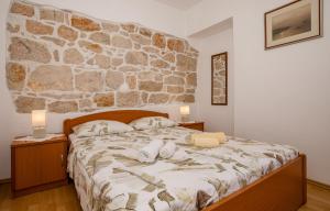 Postel nebo postele na pokoji v ubytování Apartments Kordić