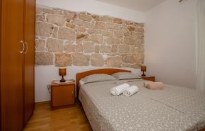 Postel nebo postele na pokoji v ubytování Apartments Kordić