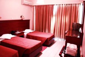 Postel nebo postele na pokoji v ubytování Apollo Hotel