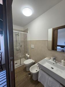 a bathroom with a toilet and a sink and a shower at Agriturismo Barbitto in Sezze +28 photos