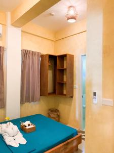 Postel nebo postele na pokoji v ubytování Kalija Homestay