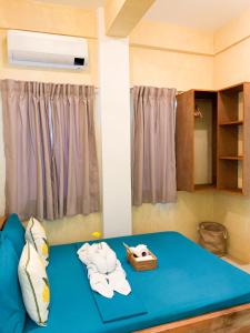 Postel nebo postele na pokoji v ubytování Kalija Homestay