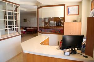 TV a/nebo společenská místnost v ubytování Hotel Carabela 2