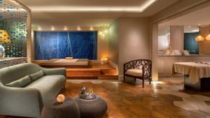a living room with a couch and a bed at Crowne Plaza Florya Istanbul by IHG in Istanbul