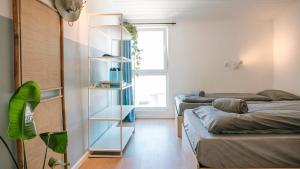 Ένα ή περισσότερα κρεβάτια σε δωμάτιο στο SURFbase Lisbon +31 φωτογραφίες