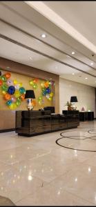 a large lobby with balloons on the wall at The Venice Luxury Residences Condominium 28B Bellini, McKinley Hill, Taguig City, Philippines in Manila