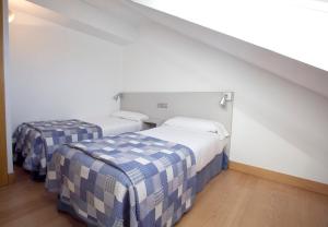 Apartamentos Jauregui客房内的一张或多张床位