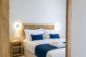 Postel nebo postele na pokoji v ubytování Pandrossos Hotel