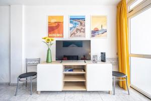 an office with a white desk and two stools at Holiday Dream Maspalomas in Maspalomas