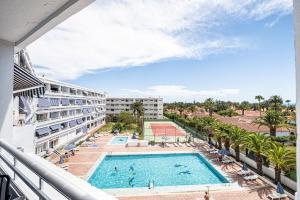 a view of the pool from the balcony of a resort at Holiday Dream Maspalomas in Maspalomas