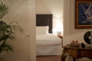 A bed or beds in a room at UNIQUE Homes Lajares - Only Adults