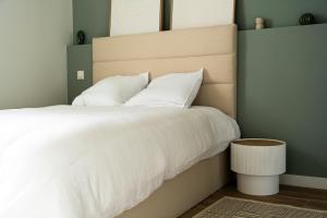 Ένα ή περισσότερα κρεβάτια σε δωμάτιο στο Appartement cosy tout confort et calme en Ardéche,parking privé