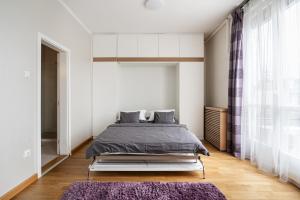 Posteľ alebo postele v izbe v ubytovaní Amora Homes Breathless Basilica view elegant flat with balcony NEED RESERVATION X FREE PARKING