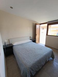 Łóżko lub łóżka w pokoju w obiekcie Pension Doña Lubina