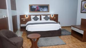 Postel nebo postele na pokoji v ubytování Kaslon Hotel