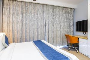 Postel nebo postele na pokoji v ubytování Hotel Livbox at Supernova