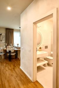 a bathroom with a toilet and a sink at Nook in Timişoara +66 photos