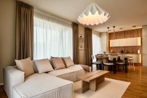 a living room with a couch and a table at Nook in Timişoara