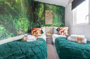 Ένα ή περισσότερα κρεβάτια σε δωμάτιο στο Holiday Home in Hastings +9 φωτογραφίες