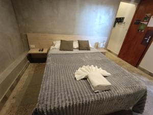 Una cama o camas en una habitación de Taguato